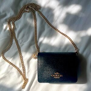 Black Coach wallet on chain.